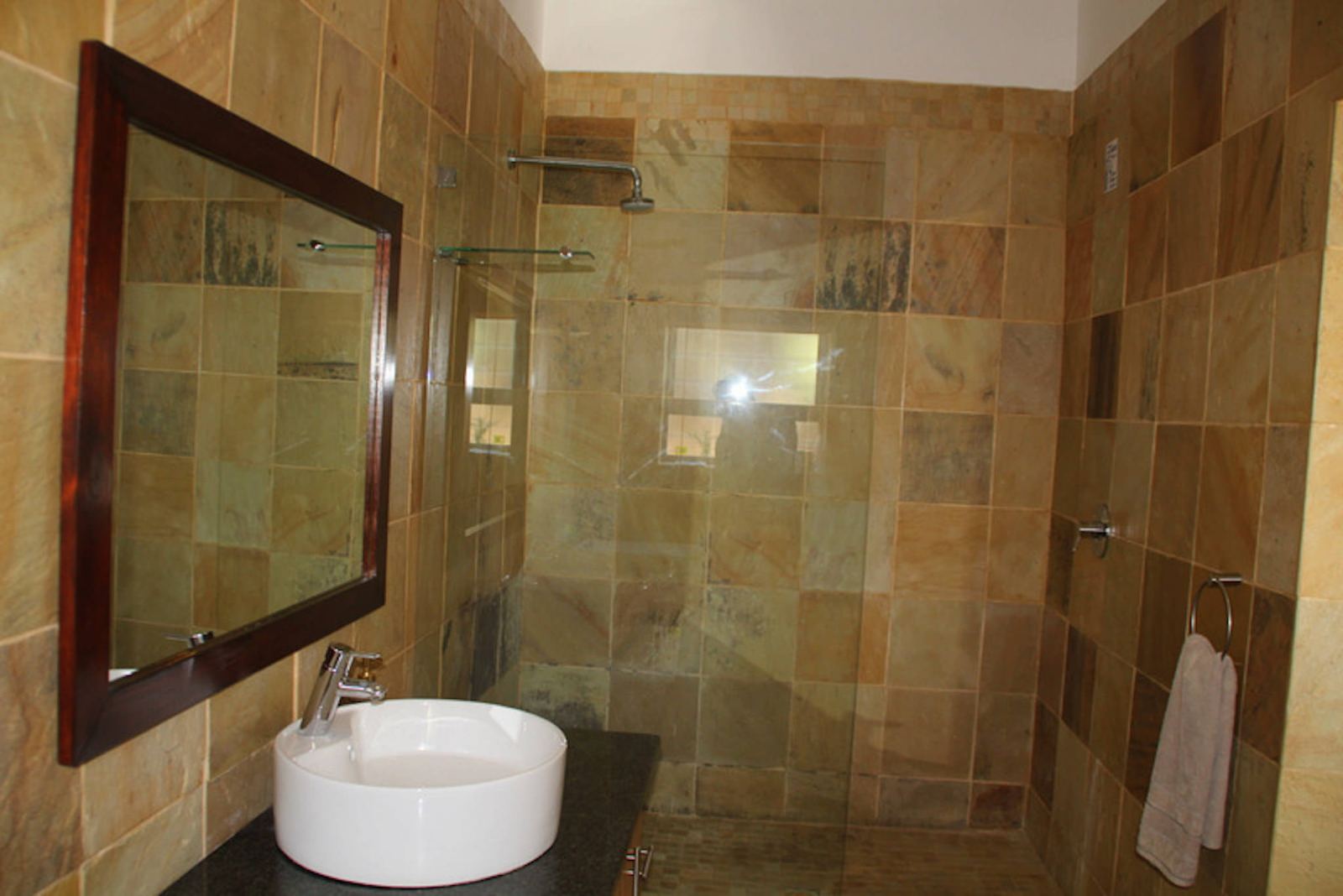 Tubes sandstone shower with a bay view window