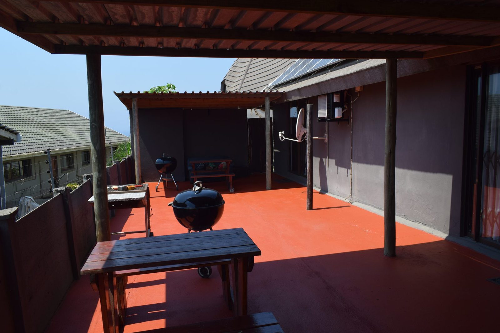 Courtyard and covered, fenced back patio shared by units 4 and 5