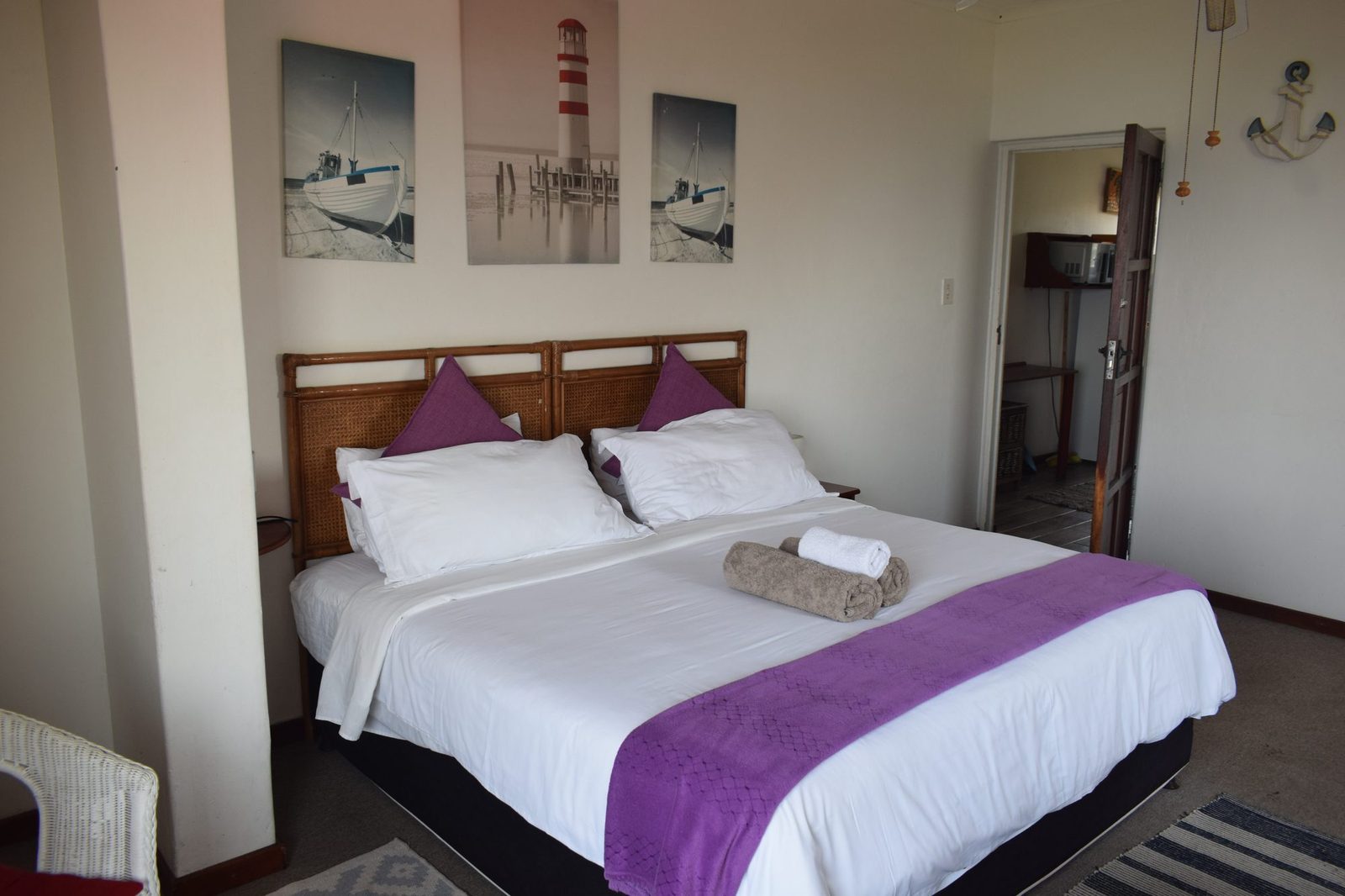 Whale bedroom with bed and wall art